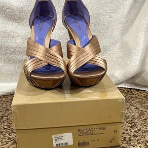 Sergio Rossi minor scuffs on bottom soles of shoe heel shown in picture